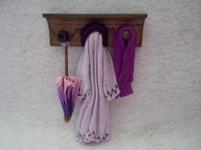wall rack with coat, scarf, umbrella