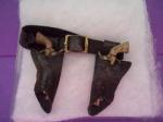 Aged Black Holster and Pistols